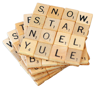 5 stacked coasters made out of 16 Scrabble tiles. The top coaster has the words snow, star, noel, and yule spelled out using the Scrabble tiles.