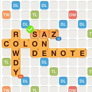 WWF game with the words colon, rowdy, and denote played on the board. The word "saz" is added on the board, also forming the words "sod" and "ane", showing an example of creating compound words.