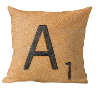 Throw pillow that looks like an "A" Scrabble tile.